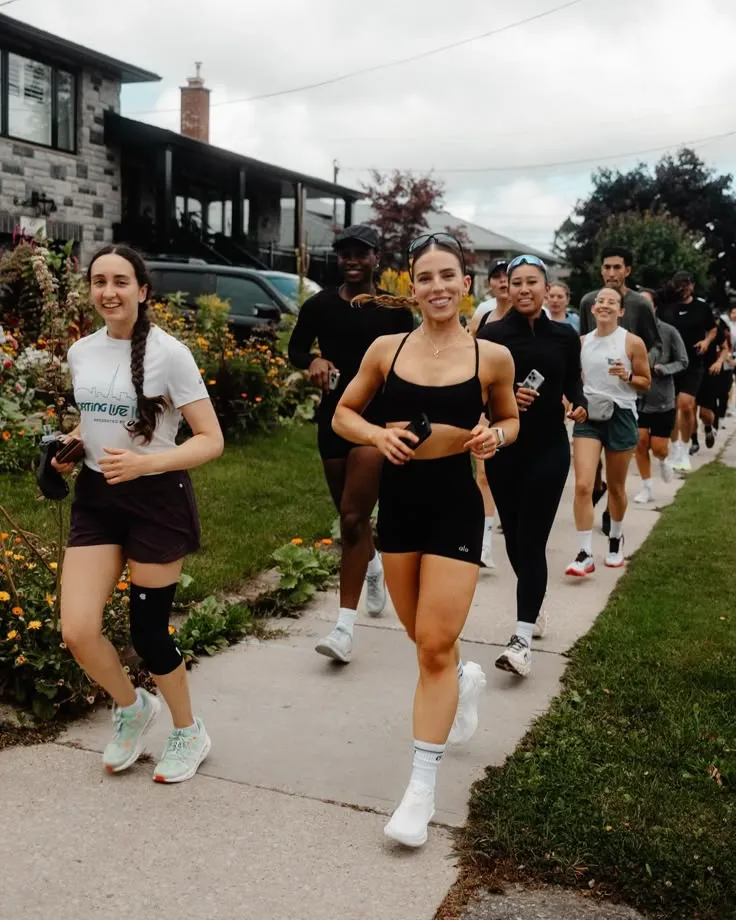 Club members reviewing walk photos together